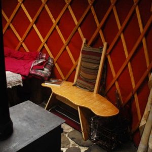 Media 'Wood stove & curved Yurt chair.' in album 'Secluded Forest Yurt'