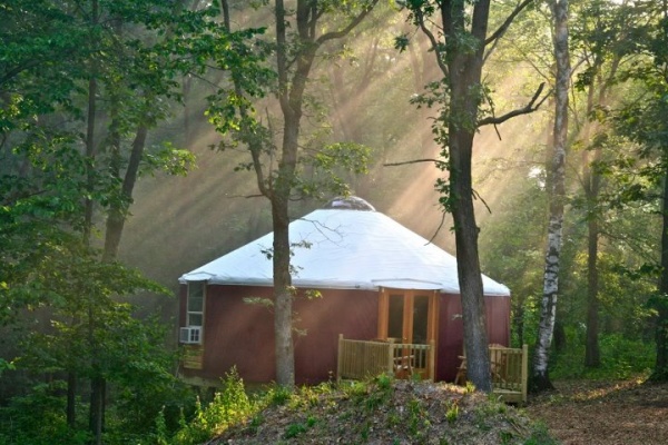 A 27' Big Sky yurt nesteled in the woods of Iowa.