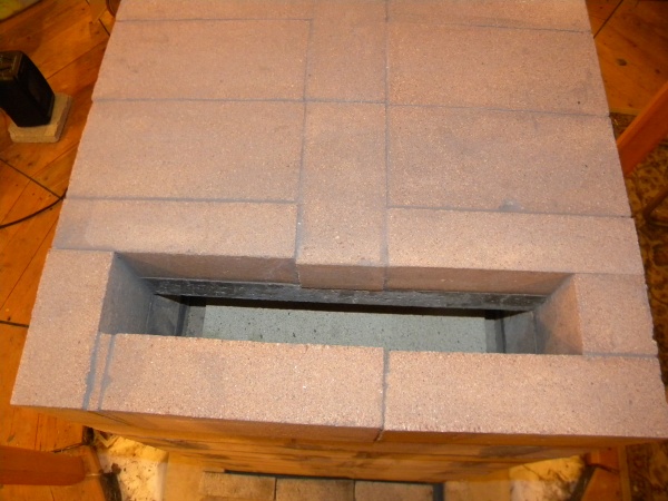 Air gap. I finally got a grout sponge for cleaning up the smeared refractory mortar.

Next level is the heat exchange channel/bell.