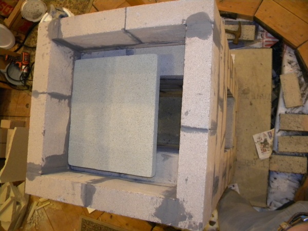 Firebox with vermiculite baffle on top.
