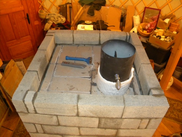 The very top. To be capped/filled with perlcrete & mortar.